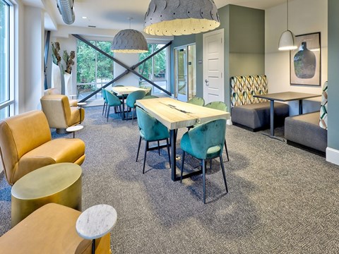 a dining room with a table and chairs